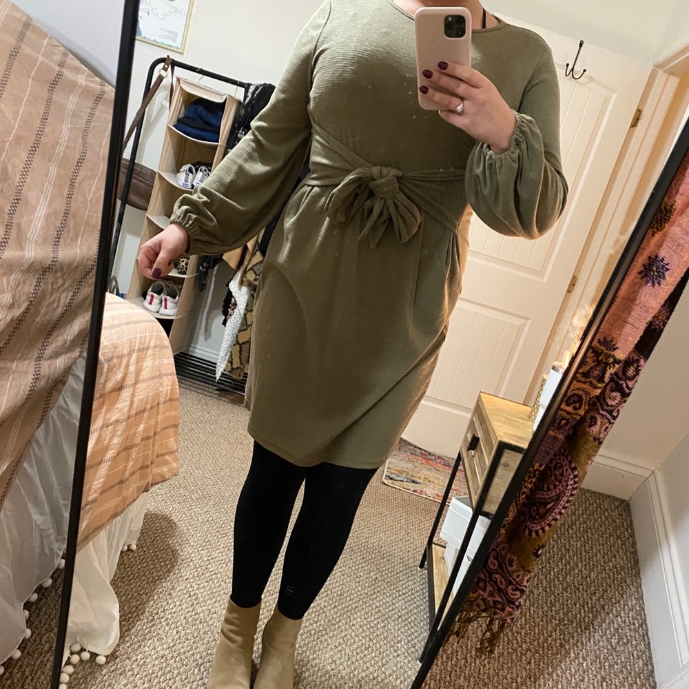 Green, long sleeved dress.